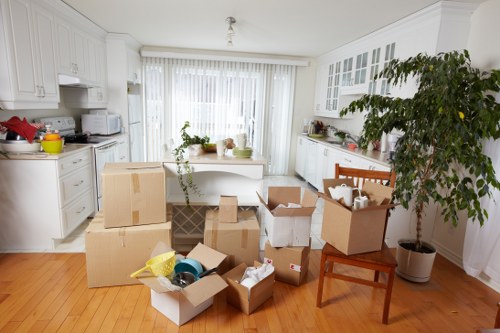 Team preparing for office removals with labeled equipment and paperwork
